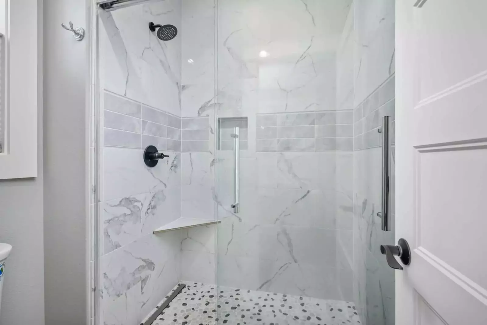 The shower is spacious, up to date, and has excellent water pressure.
