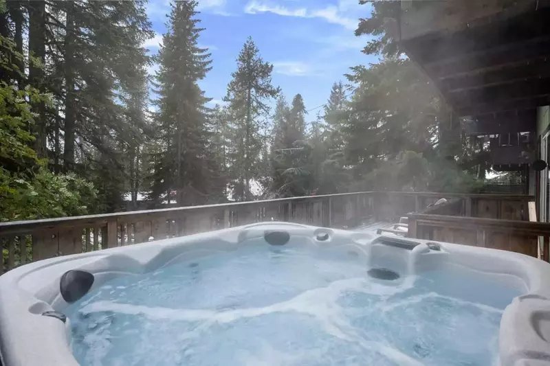 After a day skiing or hiking, return to the chalet to relax on the spacious deck with a soak in the private hot tub.