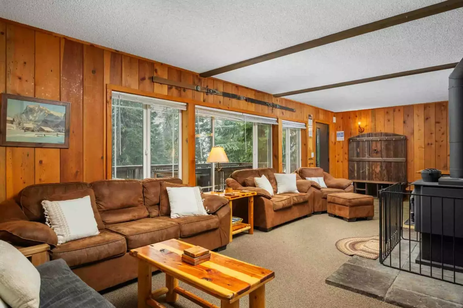 Spread across three levels, this charming chalet offers a main living area on the first two floors, complete with cozy furnishings.