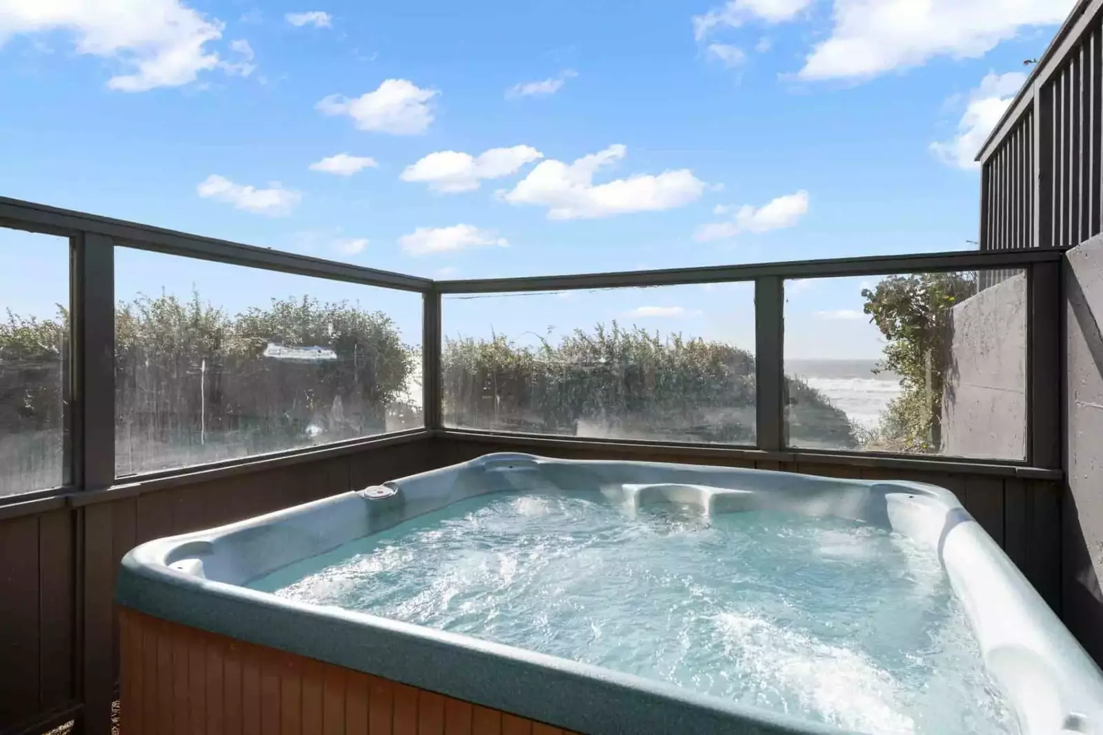 Multiple decks, including a wind-screened hot tub.