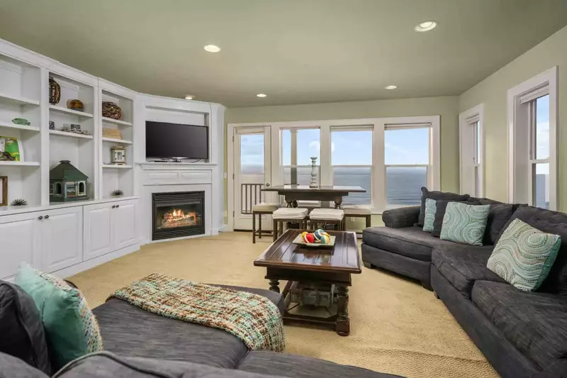 The lounge has a fireplace, ocean views, smart tv, and is incredibly cozy.