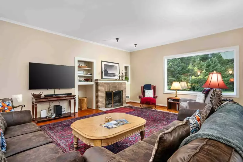 This spacious home features nine bedrooms, five bathrooms, and two kitchens, offering plenty of room for everyone to relax and unwind.