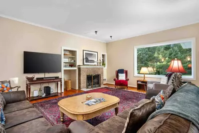 This spacious home features nine bedrooms, five bathrooms, and two kitchens, offering plenty of room for everyone to relax and unwind.