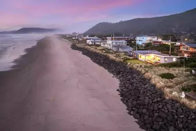 Just beyond the backyard, are miles of sandy beach, perfect for long strolls, beachcombing, and enjoying the soothing sound of the surf.