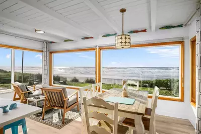 This cozy, single-level home is filled with nostalgic beach décor, creating the ideal setting to relax & escape with EPIC views of the Pacific Ocean.