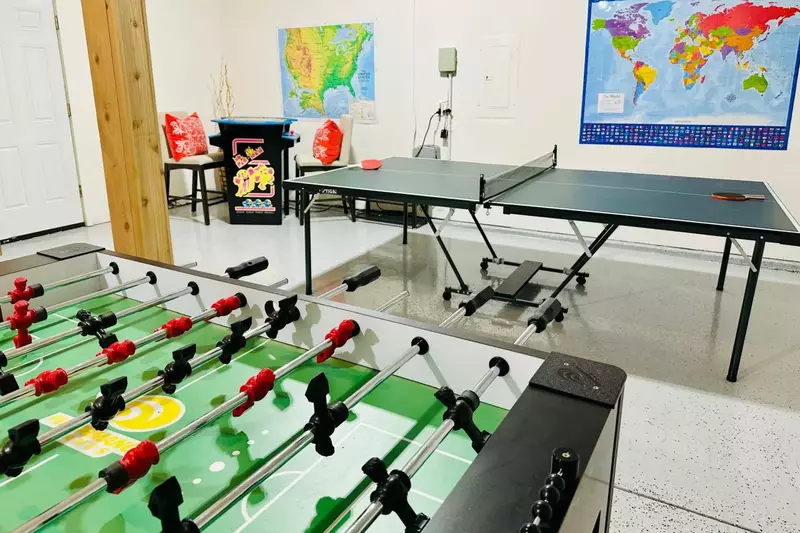 The fun continues in the converted garage game room, where you’ll find a ping pong & foosball table along with multiple game arcade system, providing