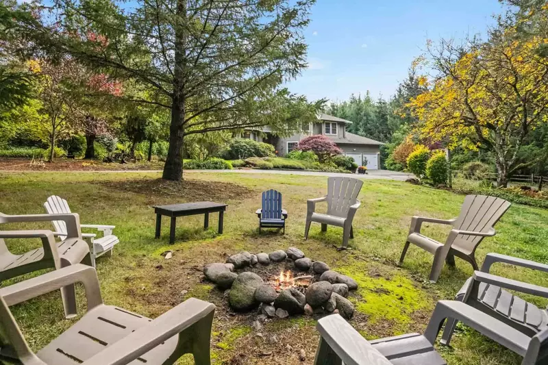 For cozy evenings, gather around the wood-burning firepit with ample seating.