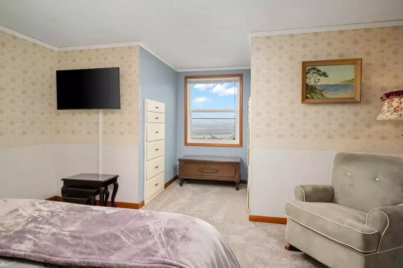 Another comfortable bed with a smart tv.