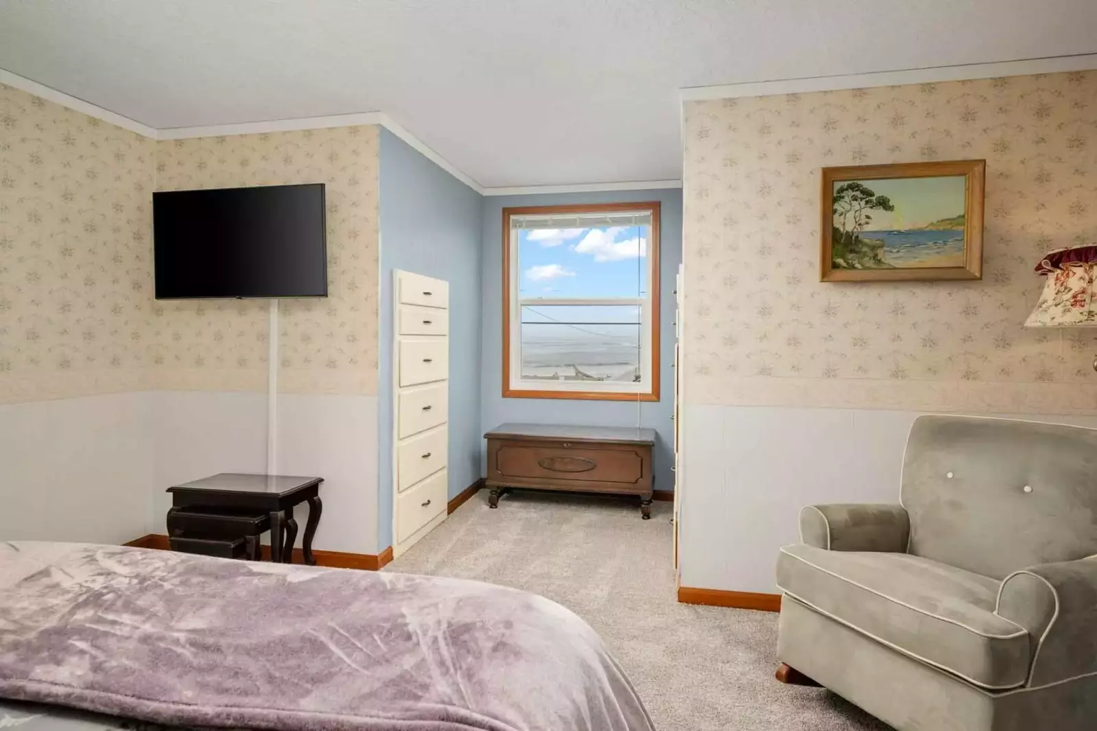 Another comfortable bed with a smart tv.