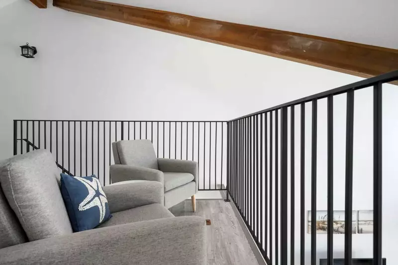 The loft area is charming, relaxing, and another great place to enjoy the ocean view.