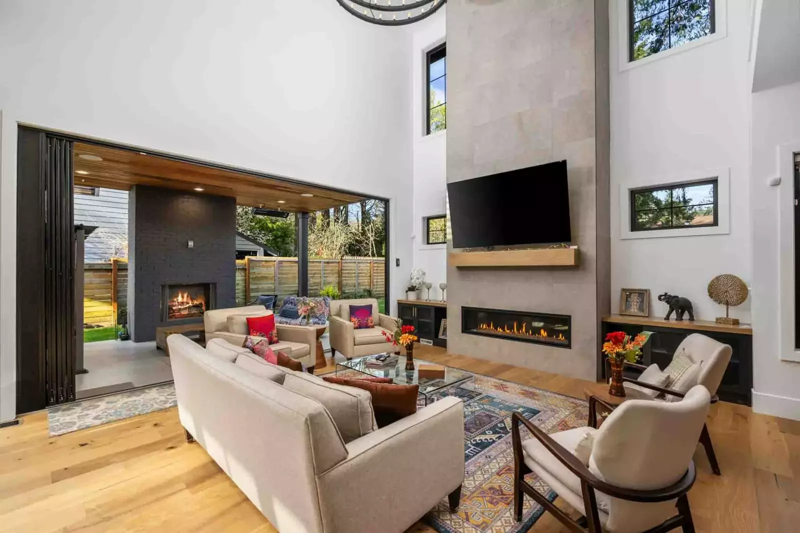 Go straight from the living room fireplace to the outdoor fireplace.