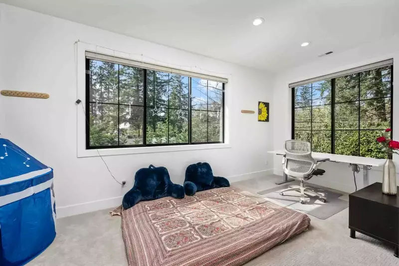 This room is very versatile. It can be a place to chill, work out, play games, or work from home.