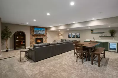 Relax in front of a cozy fire after a day on the slopes.