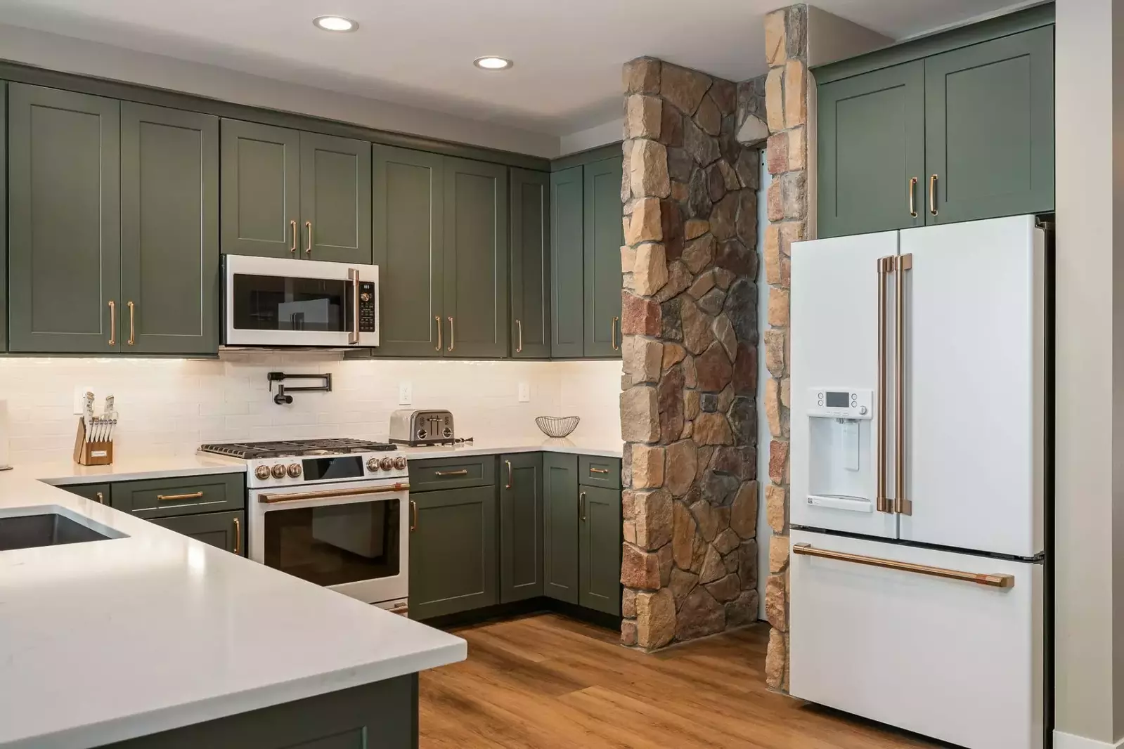 The kitchen is stocked with a robust supply of pots, pans, and appliances.