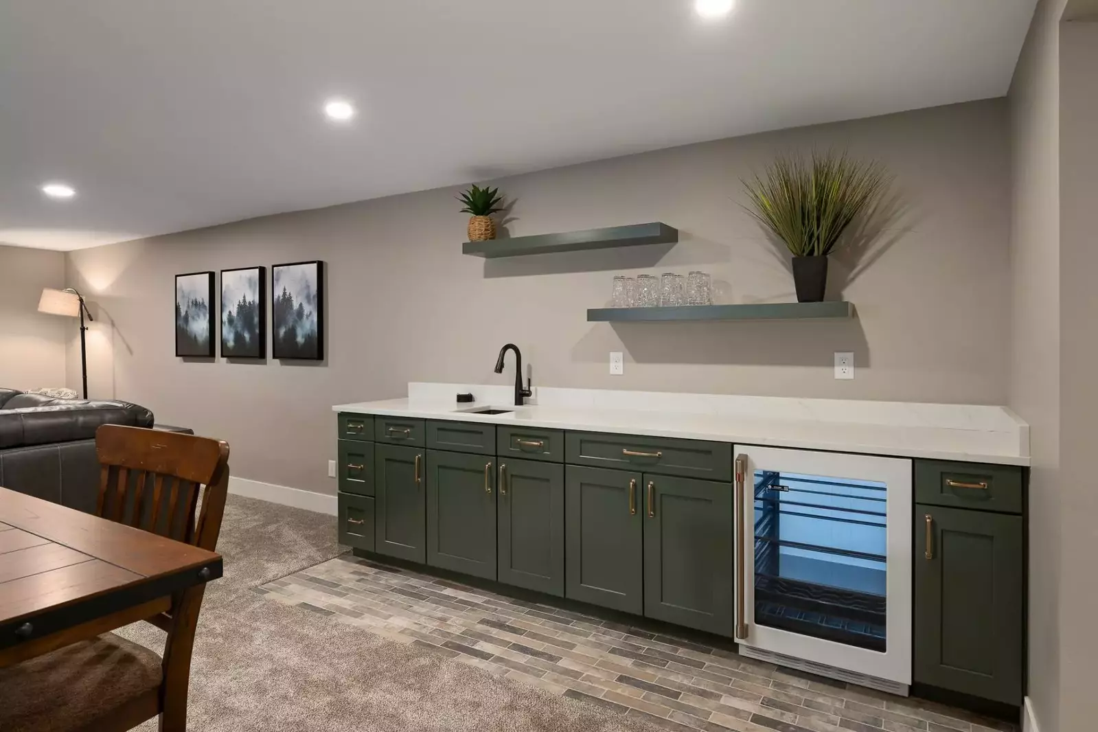 The room has a mini bar with a mini fridge and sink.