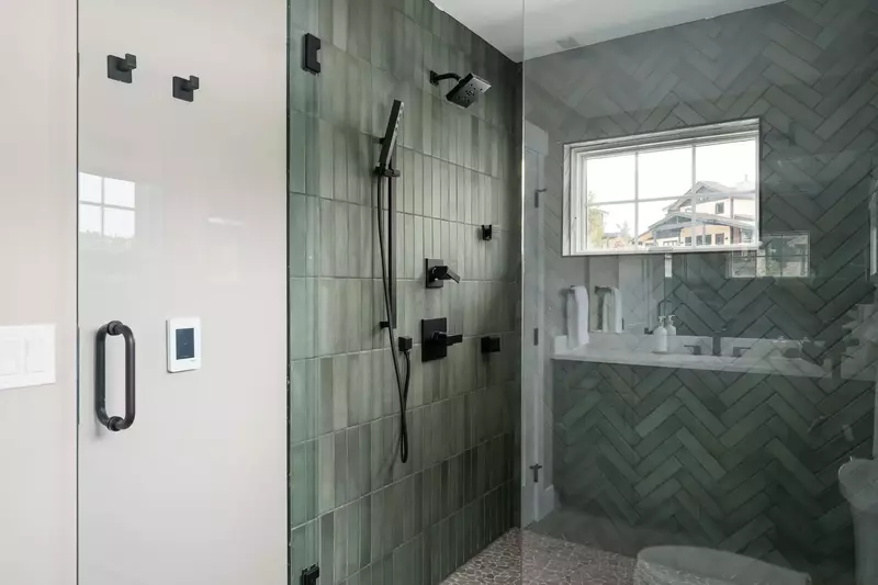 Another bathroom featuring a spacious shower with robust water pressure.