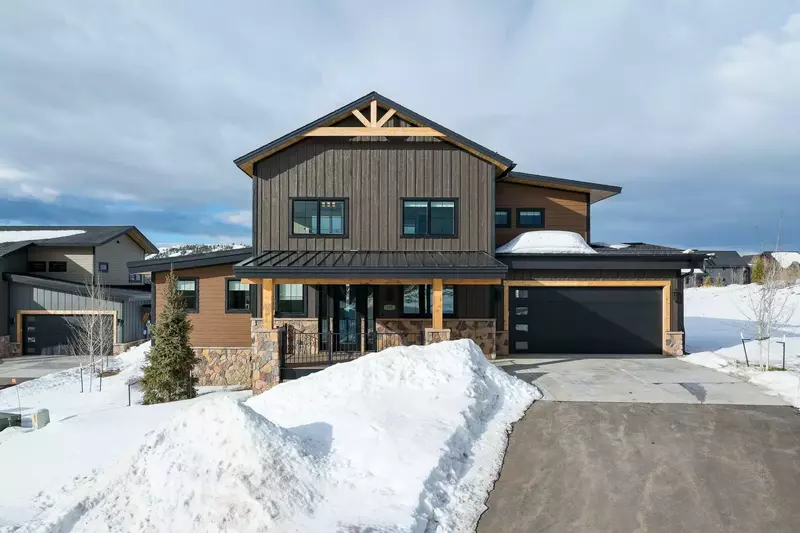 The driveway and road are plowed during winter.