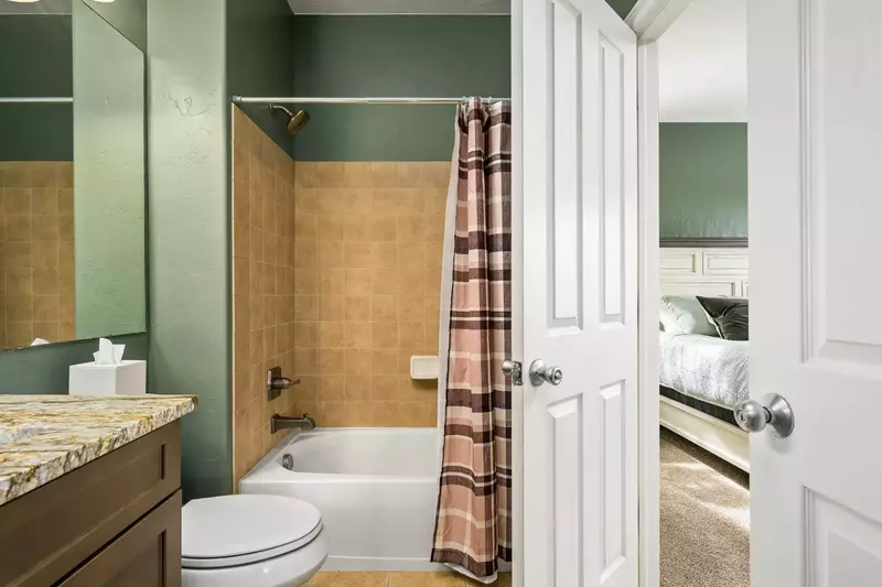 This bedroom features an en suite bathroom.