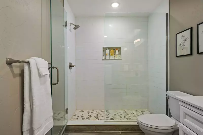 The shower is spacious, up to date, and has excellent water pressure.