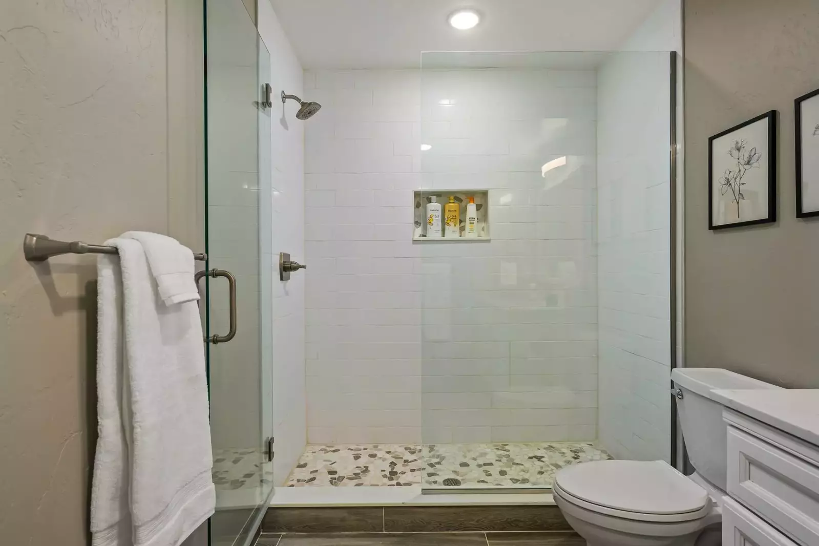 The shower is spacious, up to date, and has excellent water pressure.