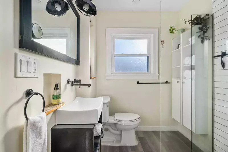 The bathroom is recently updated and ornately decorated.