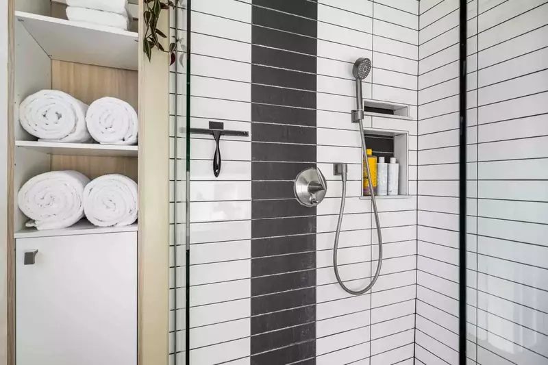 The shower is spacious, up to date, and has excellent water pressure.