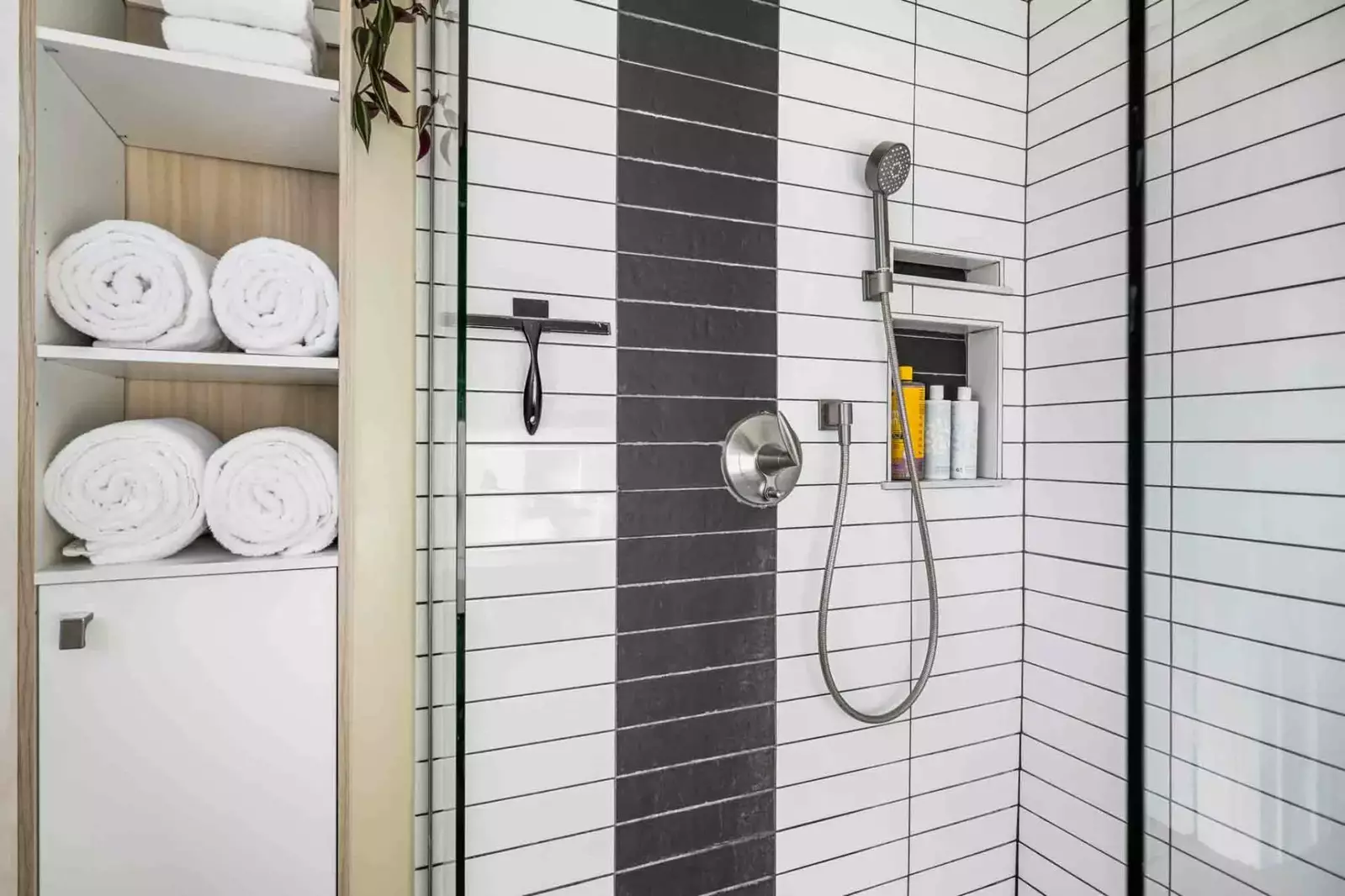 The shower is spacious, up to date, and has excellent water pressure.