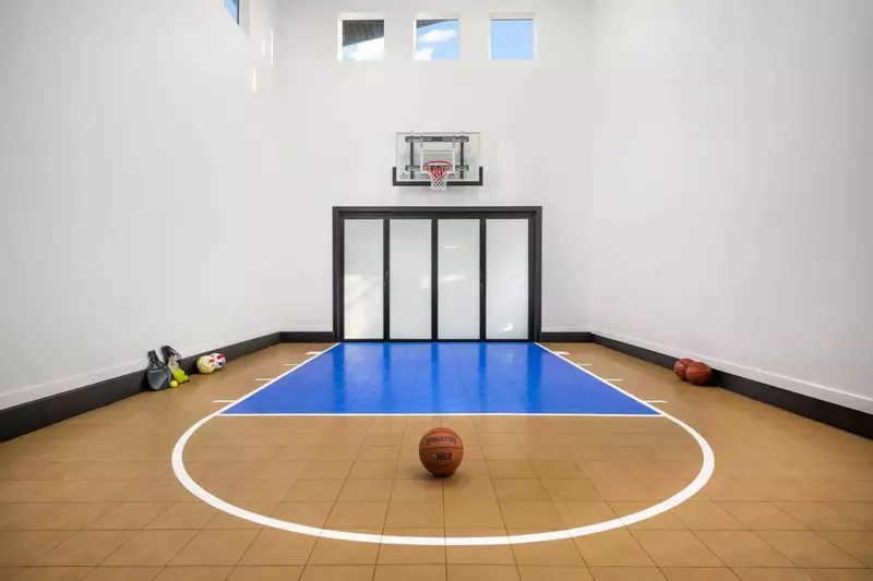 The basketball court is a great place to shoot hoops, but it has other game equipment as well.