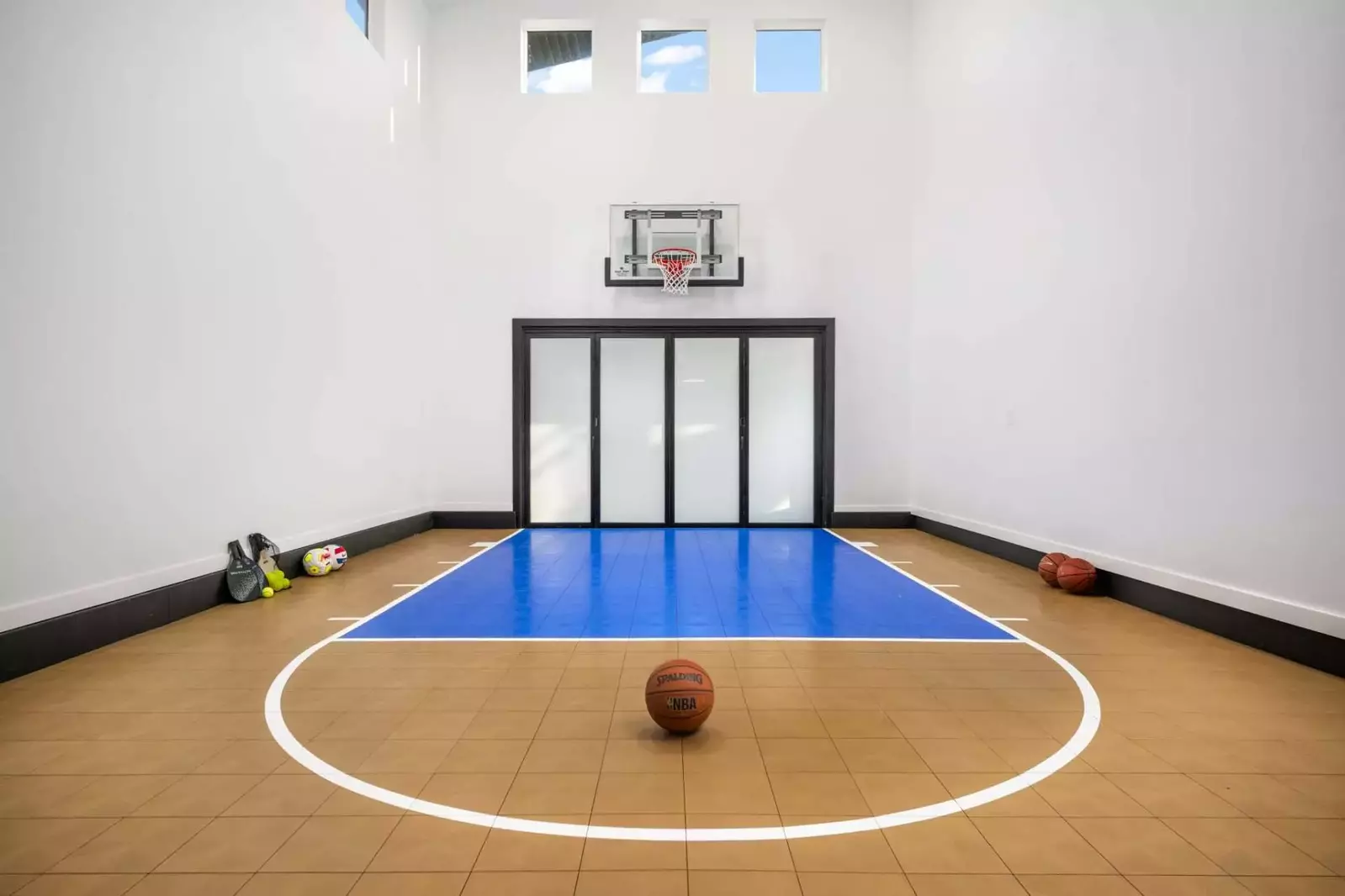 The basketball court is a great place to shoot hoops, but it has other game equipment as well.