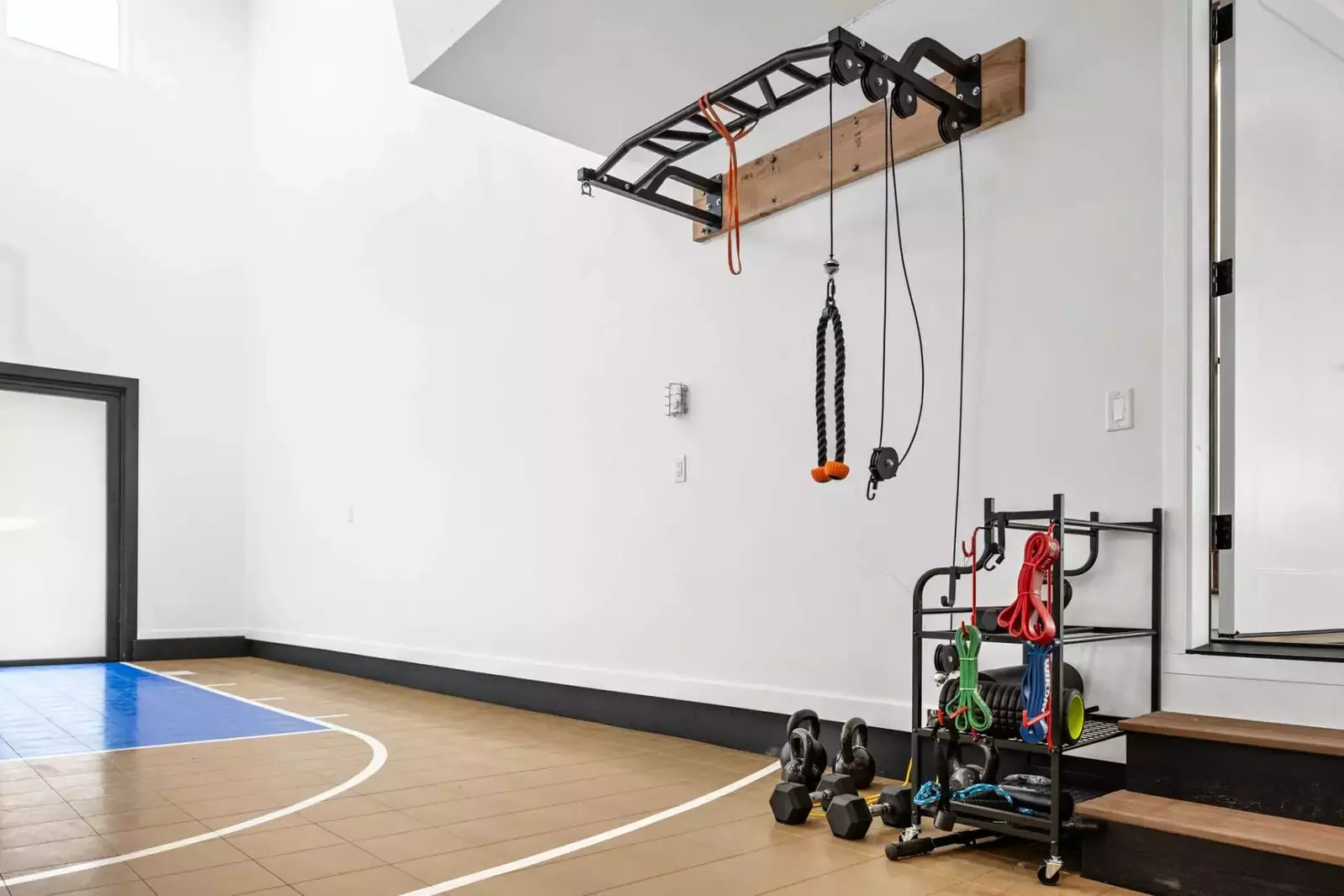 The basketball court comes with ample exercise equipment.