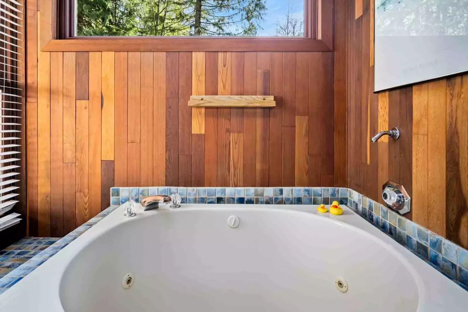 The bathtub is a deep soaking tub with jets.