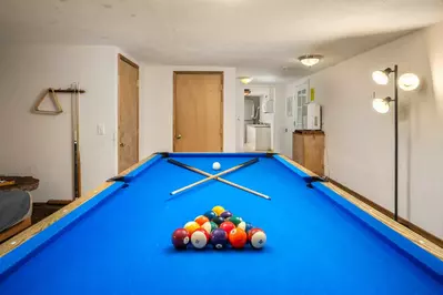 The game room has a pool table.
