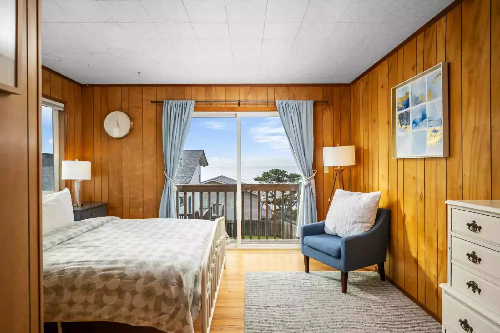 This bedroom has a lot of space and a great view.