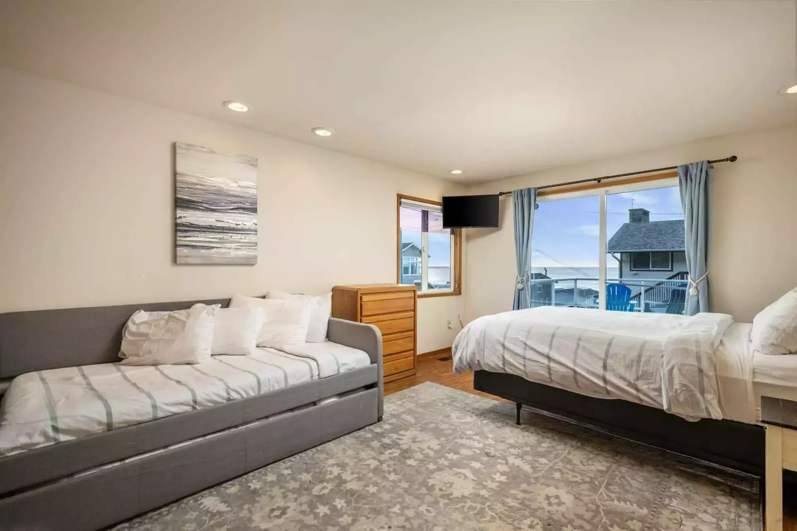 Multiple beds with a great view and a smart tv.