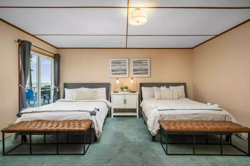 A spacious guest room with two beds.