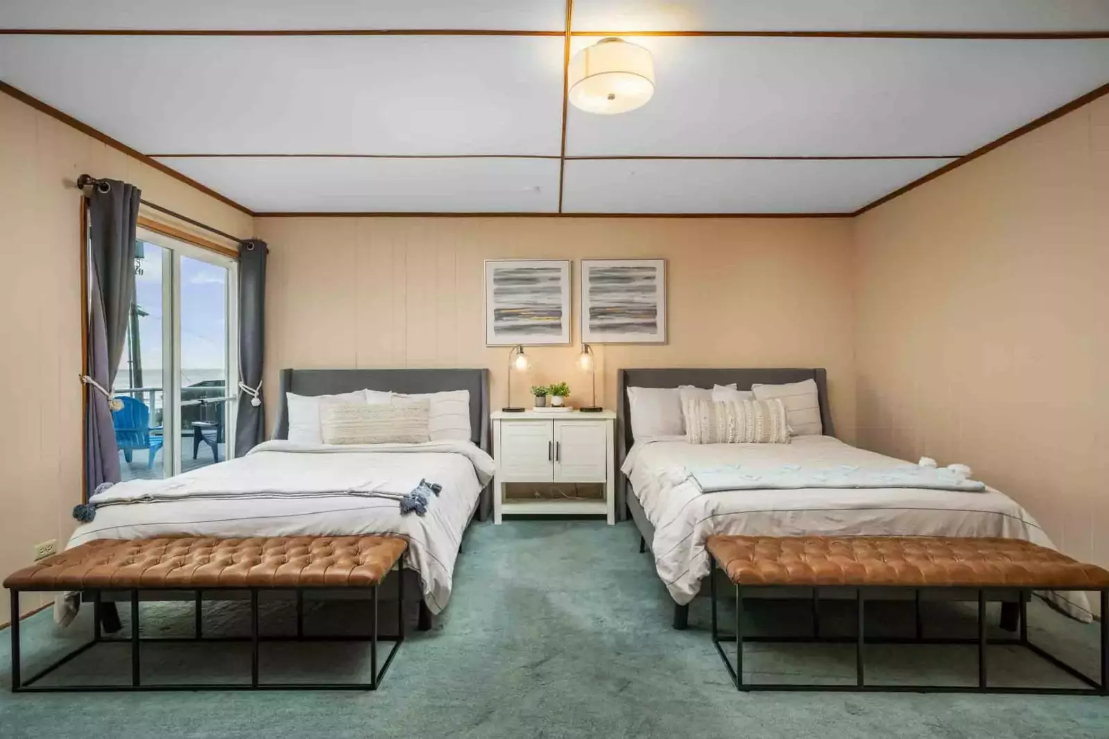 A spacious guest room with two beds.