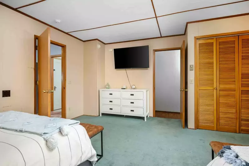 A smart tv and a spacious closet.