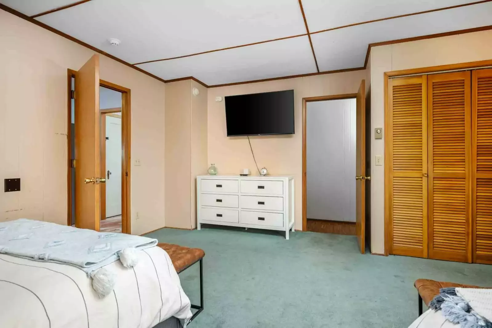 A smart tv and a spacious closet.