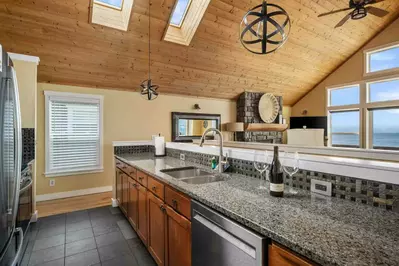 The kitchen is spacious and efficient. Perfect place to prepare a family meal or a quick treat. Grab some seafood and have fun!