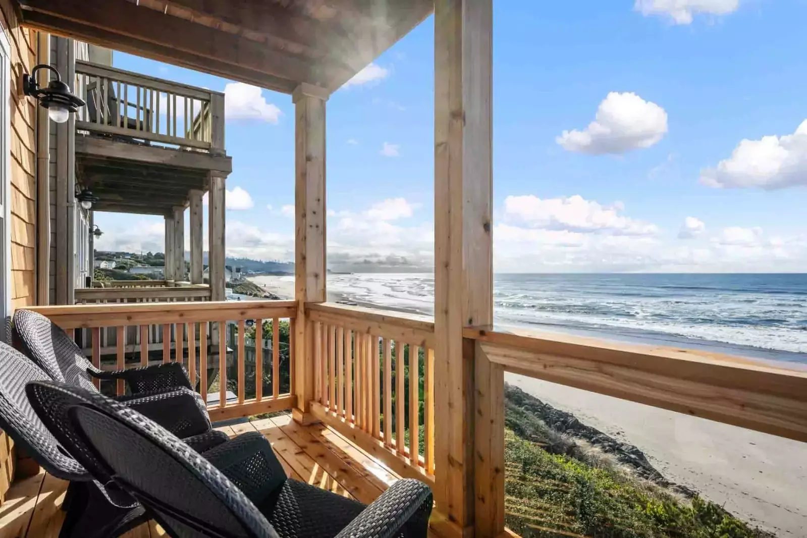 Relax on the deck looking out over the beautiful beach.
