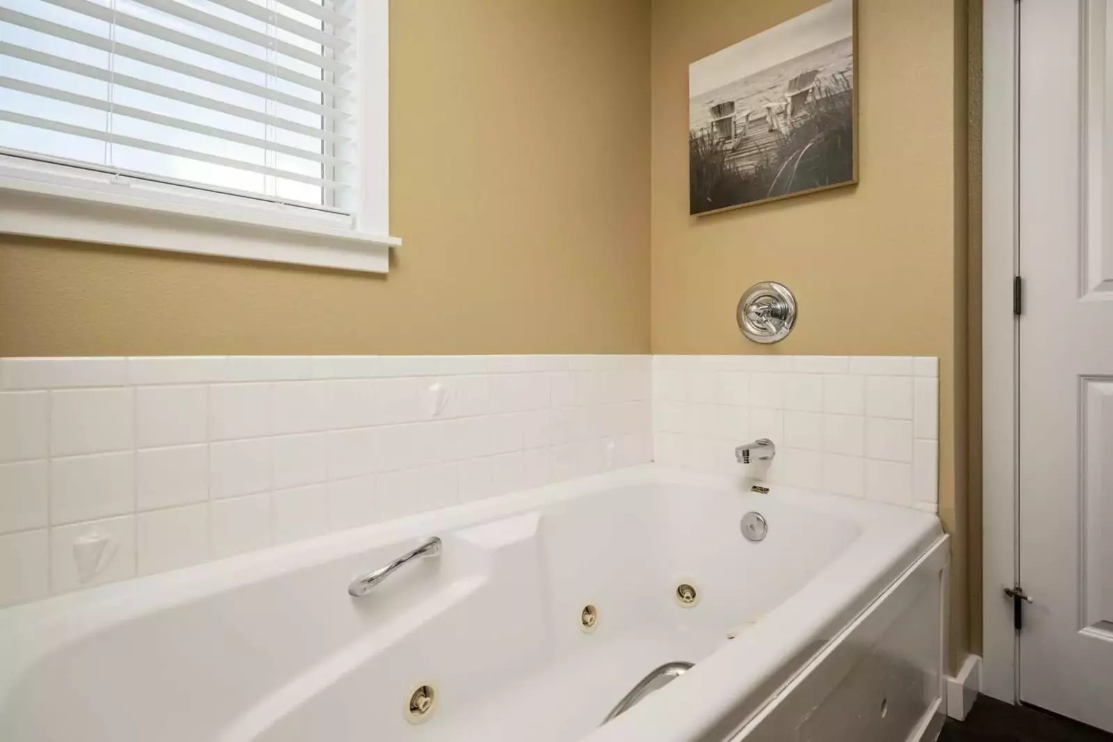 The tub is set up with jacuzzi jets.