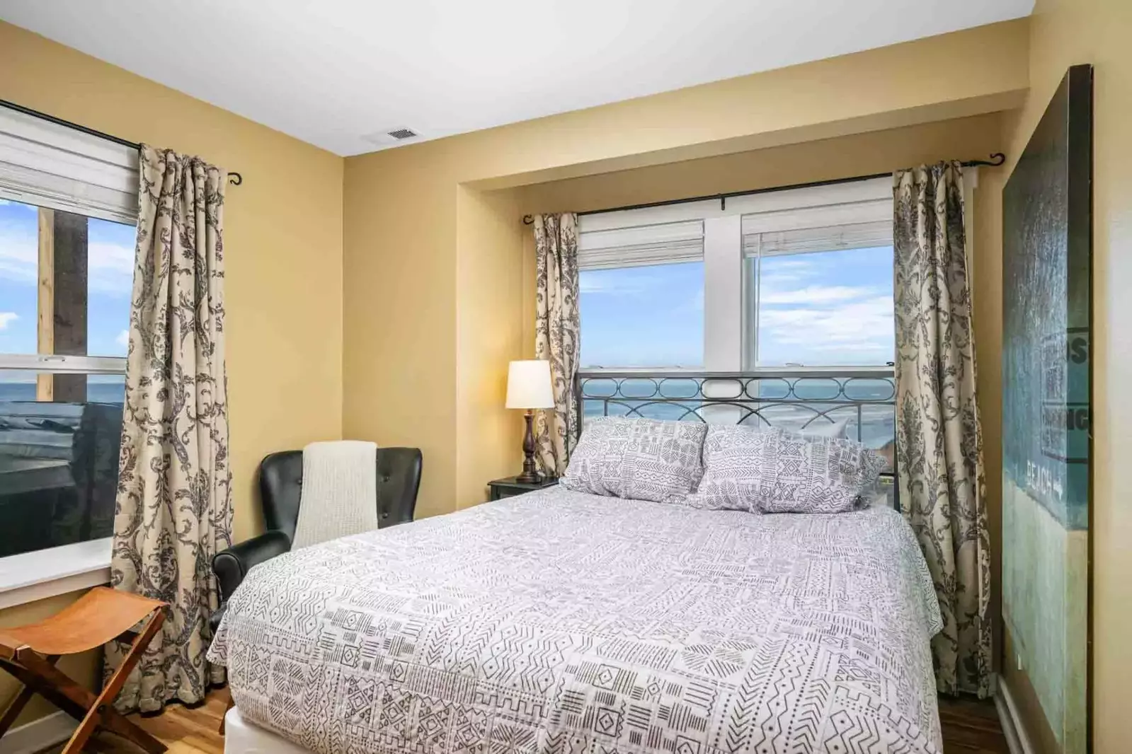 Enjoy the ocean air and view while relaxing in the comfortable bed.