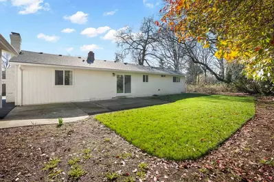 The yard is a great place for people to play games, read a book, or have a picnic.