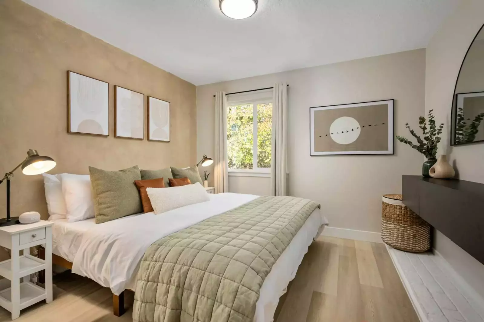 This bedroom is spacious with an incredibly comfortable bed.