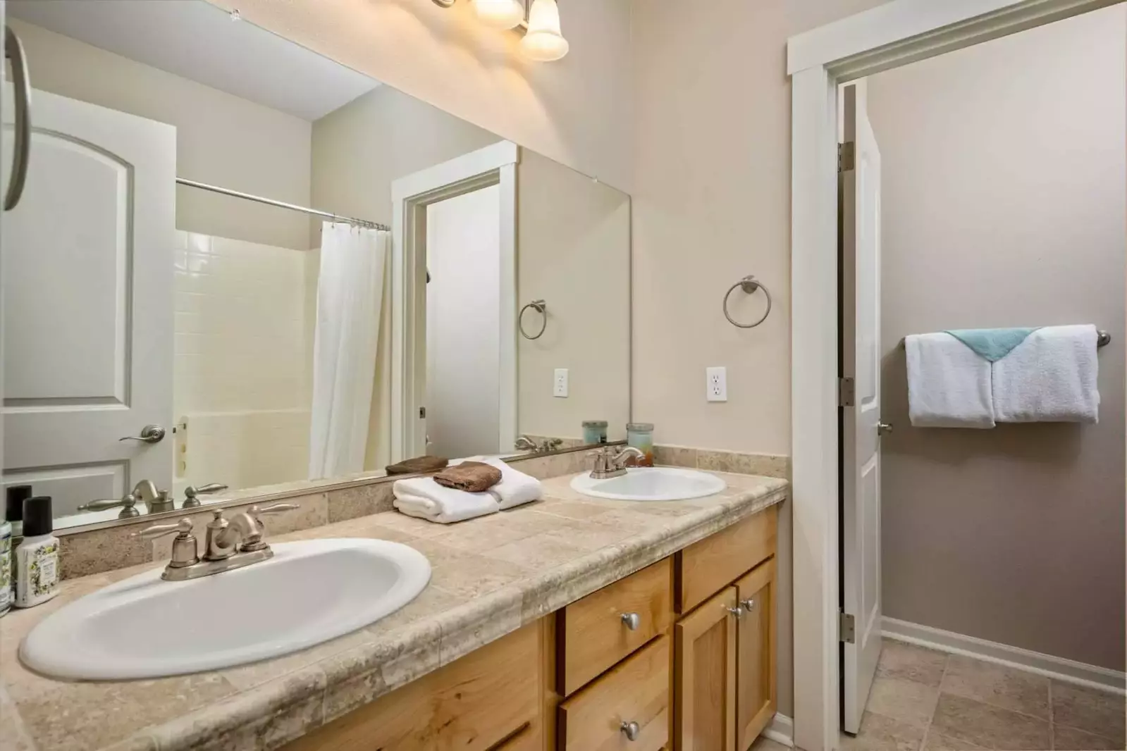 This bathroom has two sinks and excellent water pressure.