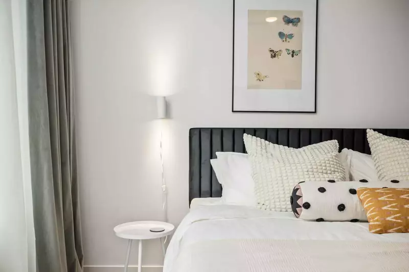 This bedroom is spacious with an incredibly comfortable bed.