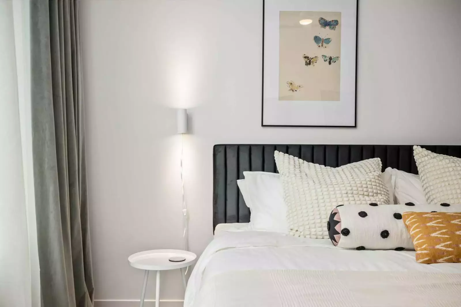 This bedroom is spacious with an incredibly comfortable bed.