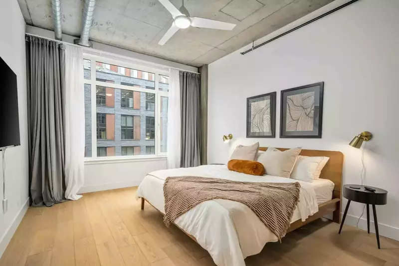 This room has exquisite design, a comfy bed, smart tv, ceiling fan, and a great view!