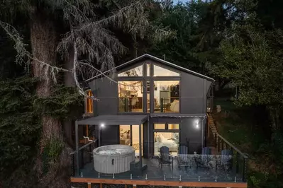 "We loved the hot tub on the deck and being able to relax and look out at the river from all the large windows." - Sarah