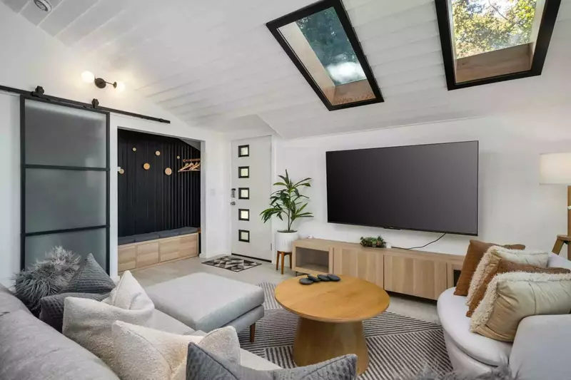 Watch you favorite movies, shows, and sports on this smart tv while relaxing in this cozy living room.